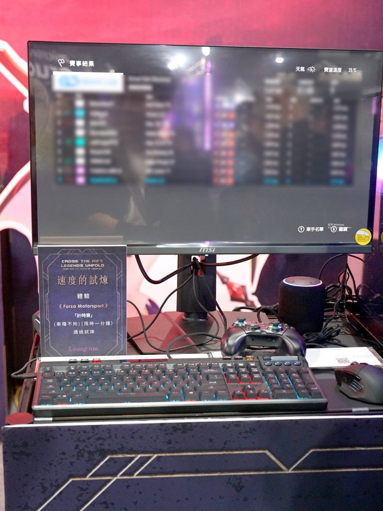 Forza Motorsport running on an MSI QD-OLED gaming monitor at a trade show booth