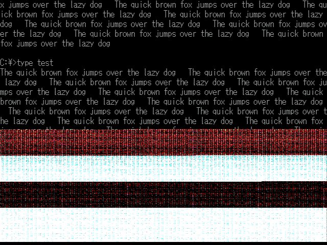 Scrolling text split by a horizontal tear on an old PC display